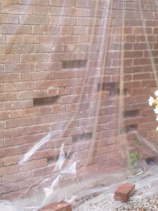 June 27, 2025 – Plastic sheeting protects work-in-progress